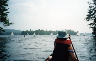 In the canoe among the sail boats